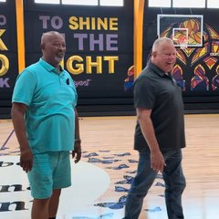 Two men on the court at a Watts gym
