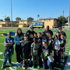 Watts Gang Task Force with youth at a football field event