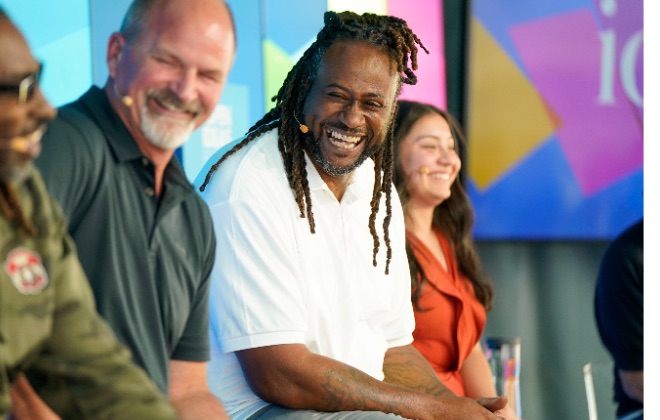 Filmmakers on stage at the Aspen Ideas Festival, one of them laughing mid-answer