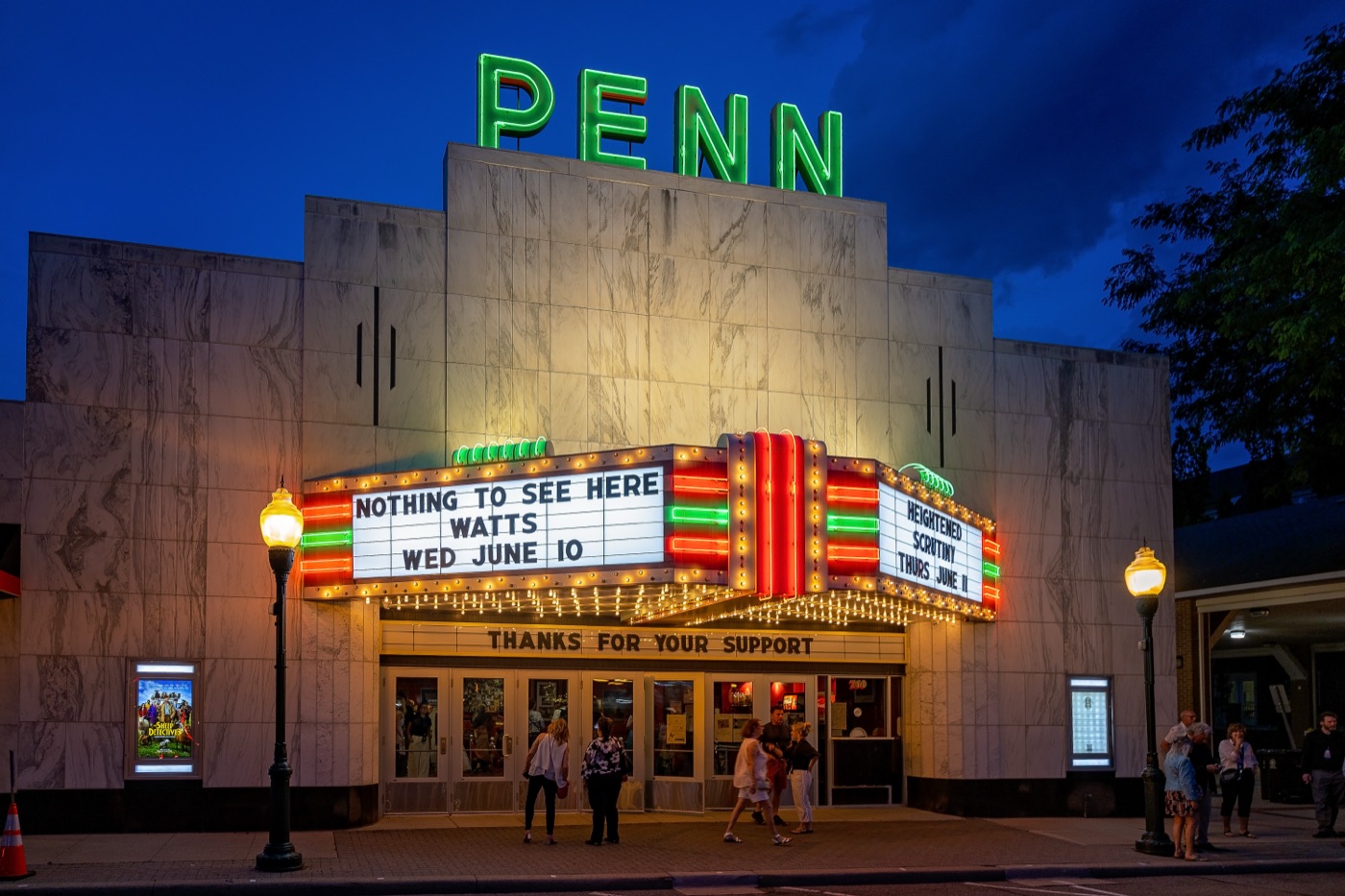 The Penn Theatre's marquee lit at night with the film's title